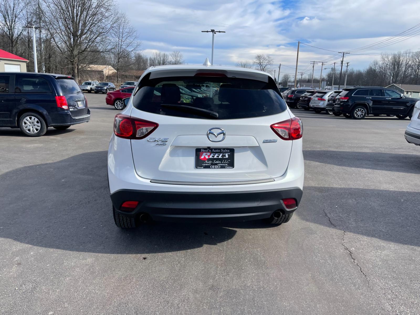 2015 White /Black Mazda CX-5 Touring AWD (JM3KE4CYXF0) with an 2.5L I4 DOHC 16V engine, 6-Speed Automatic transmission, located at 547 E. Main St., Orwell, OH, 44076, (440) 437-5893, 41.535435, -80.847855 - This 2015 Mazda CX-5 Touring AWD is a well-equipped SUV that offers a blend of performance, safety, and convenience for its drivers. Being a one-owner vehicle as per its Carfax report signifies well-attended maintenance and care. It is loaded with advanced features such as Blind Spot Monitoring and - Photo #11